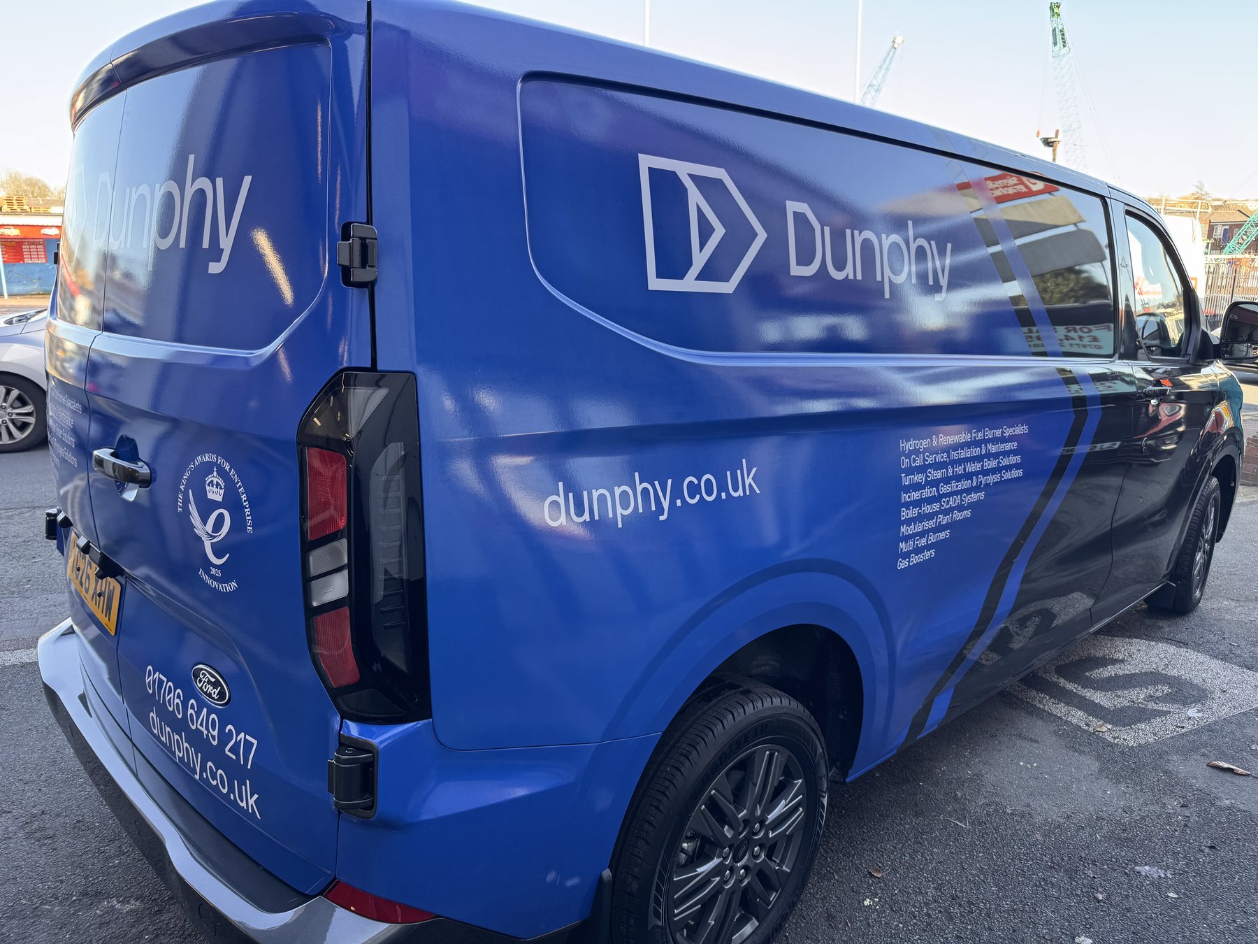 Dunphy blue branded van wrap